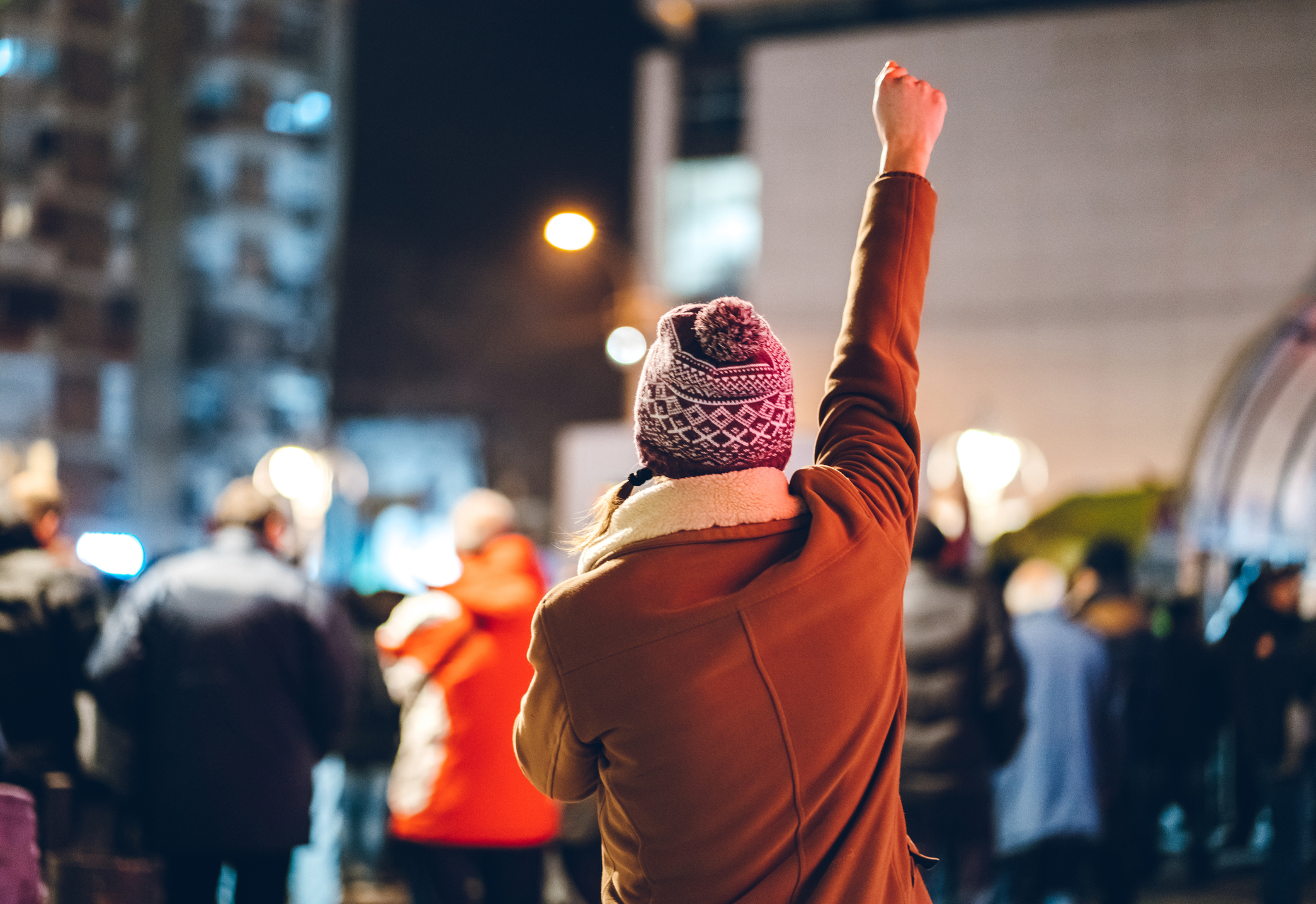 Protester with arm raised